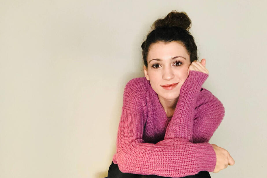 Jessica leaning on a chair